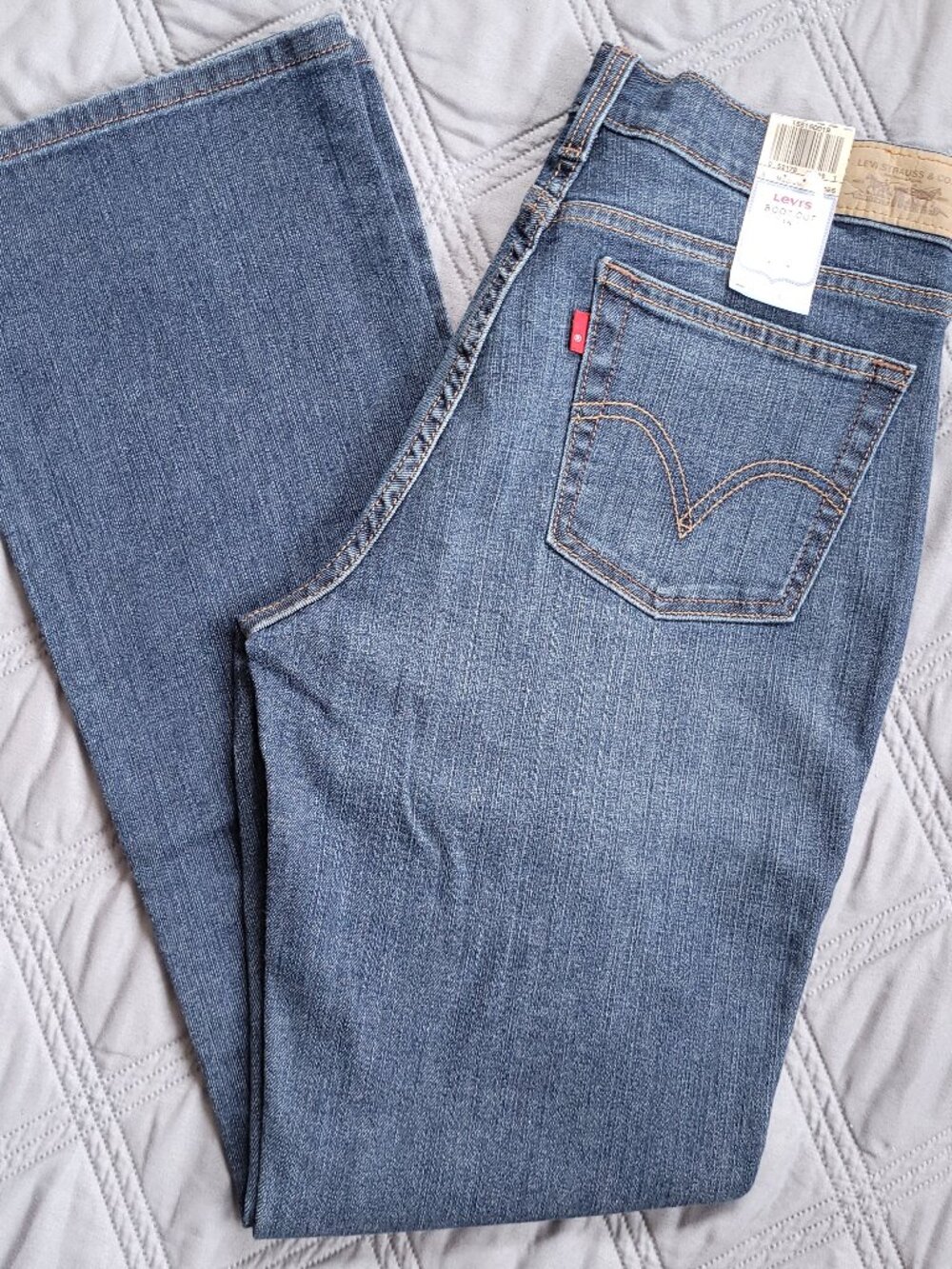 New Levi's Boot Cut 515 mid rise jeans in medium wash.